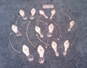 Classic dance step notes embedded in a Seattle sidewalk.